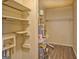 Laundry area with shelving, water heater and hookups at 707 Battlecreek Rd, Jonesboro, GA 30236