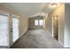 Bright bedroom with plush carpeting and access to deck at 10178 Allen Sw Dr, Covington, GA 30014