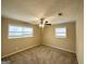 Spacious bedroom with neutral walls, carpet, and a ceiling fan at 10178 Allen Sw Dr, Covington, GA 30014