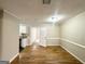 Hardwood floor dining room with access to kitchen and hallway at 10178 Allen Sw Dr, Covington, GA 30014