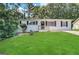 Updated Ranch home features a fresh coat of paint and a well-manicured lawn at 10178 Allen Sw Dr, Covington, GA 30014