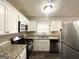 Recently remodeled kitchen with granite countertops and stainless steel appliances at 10178 Allen Sw Dr, Covington, GA 30014