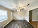 Spacious living area with hardwood floors, neutral walls and ceiling fan at 10178 Allen Sw Dr, Covington, GA 30014