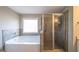 Spa-like bathroom with soaking tub and walk-in shower at 1145 Red Bud Cir, Villa Rica, GA 30180