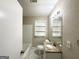 Bathroom with granite vanity, bathtub, and updated fixtures at 3975 Phylis Pl, Decatur, GA 30035