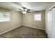 Bedroom with ceiling fan, neutral walls, and plush carpeting at 3975 Phylis Pl, Decatur, GA 30035