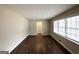 Living room with hardwood flooring and large windows providing natural light at 3975 Phylis Pl, Decatur, GA 30035
