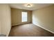 Simple bedroom with neutral walls and carpeted floors at 1914 Janet Ln, Decatur, GA 30035