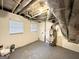 Unfinished basement with water heater and plumbing at 8401 Union Grove Rd, Lithonia, GA 30058