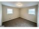 Bright bedroom with neutral walls and carpet at 8401 Union Grove Rd, Lithonia, GA 30058