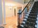 Grand staircase with ornate railing leading to upper level at 1123 Oxford Se Dr, Conyers, GA 30013