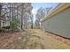 House backyard with grassy area and trees at 33 Ball St, Moreland, GA 30259