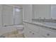 Clean bathroom with granite countertop and tiled floor at 33 Ball St, Moreland, GA 30259