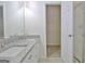 Bathroom with double vanity, granite countertop, and linen closet at 33 Ball St, Moreland, GA 30259