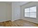 Well-lit bedroom with hardwood floors and double-door closet at 33 Ball St, Moreland, GA 30259