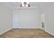Spacious bedroom with wood-look floors and two entrances at 33 Ball St, Moreland, GA 30259