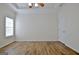Bright bedroom featuring wood-look floors and large window at 33 Ball St, Moreland, GA 30259