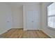 Spacious bedroom with double doors and large window at 33 Ball St, Moreland, GA 30259