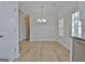 Spacious dining room with hardwood floors and chandelier at 33 Ball St, Moreland, GA 30259