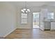 Bright dining room with hardwood floors and access to screened porch at 33 Ball St, Moreland, GA 30259