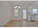 Charming dining room with hardwood floors and access to screened porch at 33 Ball St, Moreland, GA 30259