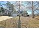 House exterior with green siding, landscaping, and a driveway at 33 Ball St, Moreland, GA 30259
