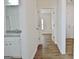 Bright hallway with wood flooring and access to rooms at 33 Ball St, Moreland, GA 30259