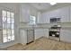 Modern kitchen with stainless steel appliances and granite countertops at 33 Ball St, Moreland, GA 30259