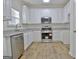 Modern kitchen with white cabinets and granite countertops at 33 Ball St, Moreland, GA 30259