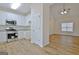 Modern kitchen with white cabinets and stainless steel appliances at 33 Ball St, Moreland, GA 30259