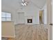 Spacious living room with fireplace, hardwood floors, and high ceilings at 33 Ball St, Moreland, GA 30259