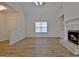 Living room featuring a fireplace and hardwood flooring at 33 Ball St, Moreland, GA 30259