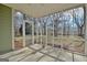 Spacious screened porch with view of the backyard at 33 Ball St, Moreland, GA 30259