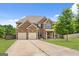 Two-story house with a three-car garage and large yard at 289 Astoria Way, Mcdonough, GA 30253