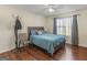 Bedroom with wood floors and a queen bed at 1235 Labonte Pkwy, Mcdonough, GA 30253