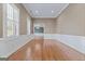 Formal dining room with hardwood floors and wainscoting at 127 Darwish Dr, Mcdonough, GA 30252