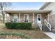 Covered porch with brick columns and white railings at 735 Willow Bend Dr, Jonesboro, GA 30238