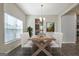 Bright dining room features hardwood floors and a view into the kitchen at 633 Mill Creek Trl, Jonesboro, GA 30238