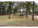 Wooded backyard with a view of the home at 371 Branham Cir, Social Circle, GA 30025