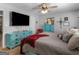 Main bedroom with teal dresser and a large TV at 950 Old Jackson Rd, Locust Grove, GA 30248