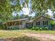 Ranch-style home with a covered porch at 950 Old Jackson Rd, Locust Grove, GA 30248