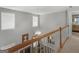 Upstairs hallway with view into living room at 1302 Eddie Craig Ct, Mcdonough, GA 30252