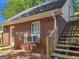 Brick building with stairs and window AC unit at 1302 Eddie Craig Ct, Mcdonough, GA 30252