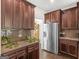 Stainless steel refrigerator and ample cabinetry highlight this kitchen at 109 Faversham Dr, Mcdonough, GA 30252