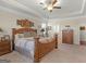 Main bedroom featuring king bed, dresser, and a view of the bathroom at 109 Faversham Dr, Mcdonough, GA 30252