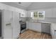 Kitchen with stainless steel appliances and wood flooring at 1293 Coan Dr, Locust Grove, GA 30248