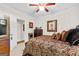 Spacious bedroom with a king-size bed and ceiling fan at 248 Montrose Dr, Mcdonough, GA 30253