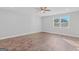 Bright living room featuring hardwood floors and a ceiling fan at 26 Eva Dr, Hampton, GA 30228