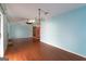 Bright dining room with hardwood floors and chandelier at 218 Groveland Dr, Peachtree City, GA 30269