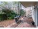 Small patio with grill and seating area at 218 Groveland Dr, Peachtree City, GA 30269